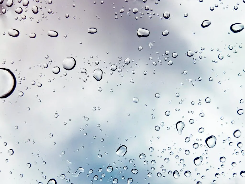Illustrative close-up of water droplets on glass; not a customer property